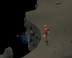 A player travelling across the chasm using a light creature.