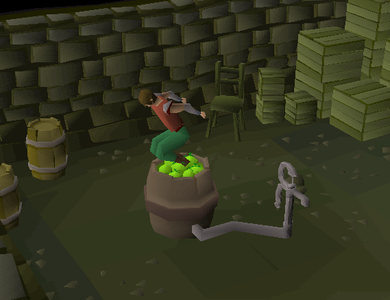 A player mushing apples in an apple press.
