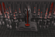 A strange vampyric statue in the upper tier of the city.