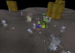 A player fights a nuclear smoke devil while defending themselves against a horde of smoke devils.